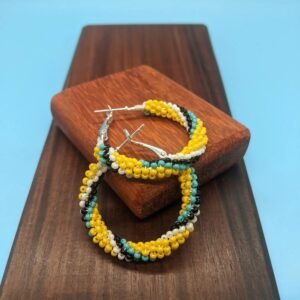 a pair of earrings on 35mm Hoop on a wood surface